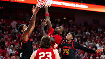 Feb 13, 2025; Lincoln, Nebraska, USA; Nebraska Cornhuskers forward Juwan Gary (4) shoots against Maryland Terrapins forward Julian Reese (10) and center Derik Queen (25) during the first half at Pinnacle Bank Arena.