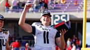 Dec 27, 2024; Fort Worth, TX, USA; Navy Midshipmen quarterback Blake Horvath (11) celebrates winning the MVP after the game against the Oklahoma Sooners at Amon G. Carter Stadium. 