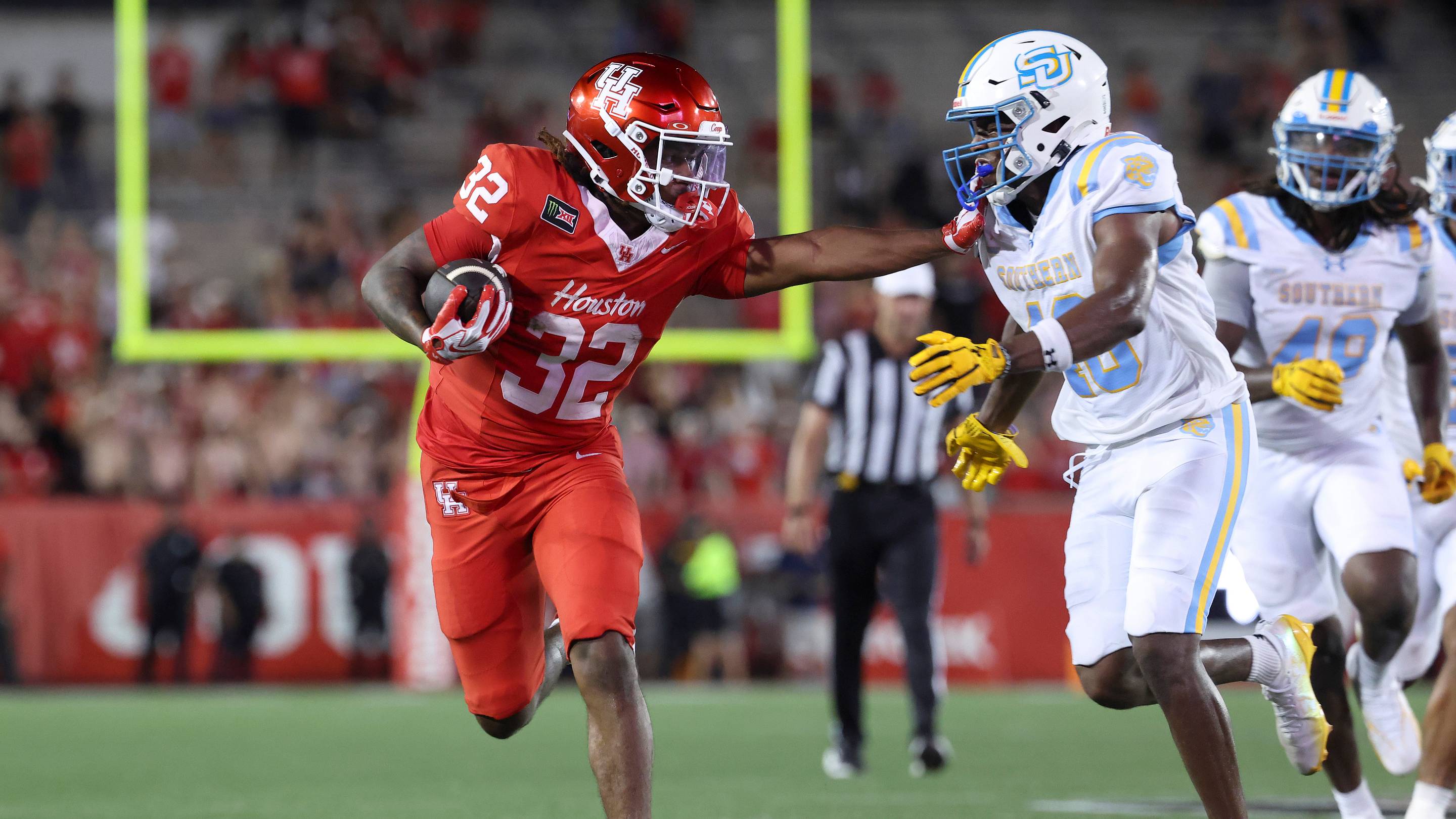 Sep 12, 2026; Houston, Texas, USA; Houston Cougars running back Nehemiah Warmate (32) runs with the ball during the fourth quarter against the Southern University Jaguars at TDECU Stadium. Mandatory Credit: Troy Taormina-Imagn Images | IMAGN IMAGES via Reuters Connect