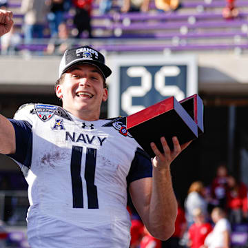 Dec 27, 2024; Fort Worth, TX, USA; Navy Midshipmen quarterback Blake Horvath (11) celebrates winning the MVP after the game against the Oklahoma Sooners at Amon G. Carter Stadium. Mandatory Credit: Andrew Dieb-Imagn Images