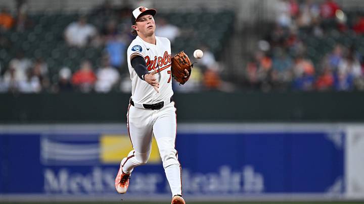 Jul 7, 2026; Baltimore, Maryland, USA;  Baltimore Orioles infielder Jackson Holliday (7) tosses the ball to first base after fielding a ground ball in the second inning against the Chicago Cubs at Oriole Park at Camden Yards. Mandatory Credit: Jamie Sabau-Imagn Images