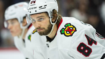 Apr 15, 2025; Ottawa, Ontario, CAN; Chicago Blackhawks left wing Landon Slaggert (84) gets in position for a faceoff in the first period against the Ottawa Senators at the Canadian Tire Centre. Mandatory Credit: Marc DesRosiers-Imagn Images