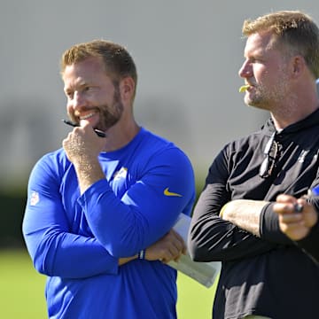Jul 29, 2024; Los Angeles, CA, USA; Los Angeles Rams head coach Sean McVay, general manager Les Snead and chief of staff Carter Crutchfield talk on the field during training camp at Loyola Marymount University. Mandatory Credit: Jayne Kamin-Oncea-Imagn Images