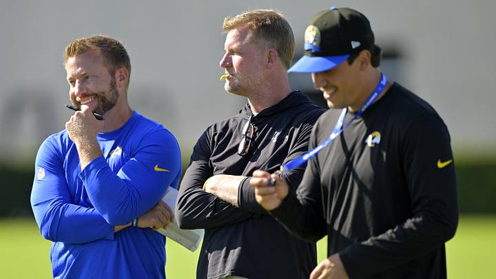 Jul 29, 2024; Los Angeles, CA, USA; Los Angeles Rams head coach Sean McVay, general manager Les Snead, and chief of staff Carter Crutchfield talk on the field during training camp at Loyola Marymount University. Mandatory Credit: Jayne Kamin-Oncea-Imagn Images