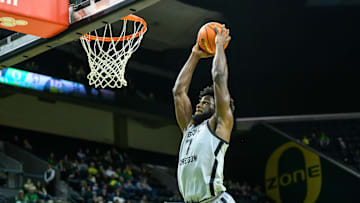 Dec 15, 2024; Eugene, Oregon, USA; Oregon Ducks forward Supreme Cook (7) dunks the ball during the second half against the Stephen F. Austin Lumberjacks at Matthew Knight Arena.