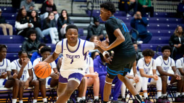 Dec 17, 2023; Bexley, Ohio, USA;
Pickerington Central's Juwan Turner (1) rushes towards the basket past Richmond Heights' Dorian Jones (11) during their game on Sunday, Dec. 17, 2023 at the Capital Center.