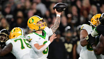 Oct 18, 2024; West Lafayette, Indiana, USA; Oregon Ducks quarterback Dillon Gabriel (8) throws a pass during the second quarter against the Purdue Boilermakers at Ross-Ade Stadium. Mandatory Credit: Marc Lebryk-Imagn Images