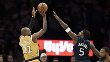 Nov 19, 2025; Minneapolis, Minnesota, USA; Washington Wizards forward Khris Middleton (22) shoots the ball over Minnesota Timberwolves guard Anthony Edwards (5) in the first half at Target Center. Mandatory Credit: Jesse Johnson-Imagn Images