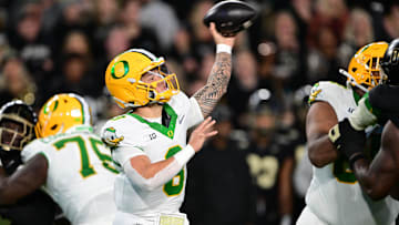 Oct 18, 2024; West Lafayette, Indiana, USA; Oregon Ducks quarterback Dillon Gabriel (8) throws a pass during the second quarter against the Purdue Boilermakers at Ross-Ade Stadium. Mandatory Credit: Marc Lebryk-Imagn Images