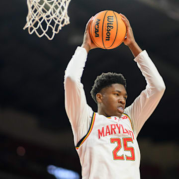 Jan 19, 2025; College Park, Maryland, USA; Maryland Terrapins center Derik Queen (25) rebounds the ball during the first half against the Nebraska Cornhuskers at Xfinity Center. Mandatory Credit: Reggie Hildred-Imagn Images