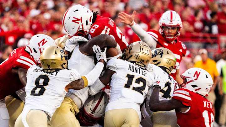 Sep 7, 2024; Lincoln, Nebraska, USA; Nebraska Cornhuskers running back Dante Dowdell (23) jumps over the pile for a first down against the Colorado Buffaloes during the second quarter at Memorial Stadium.