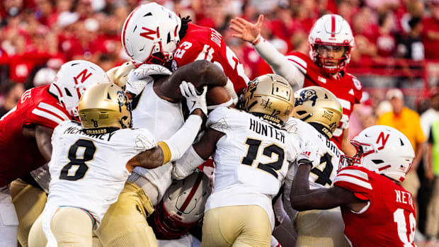 Nebraska Cornhuskers running back Dante Dowdell (23) jumps over the pile for a first down against the Colorado Buffaloes duri