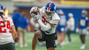 New York Giants safety Tyler Nubin (27) catches a ball in a drill during Mandatory Minicamp at Quest Diagnostics Giants Training Center in East Rutherford on Tuesday, June 17, 2025.