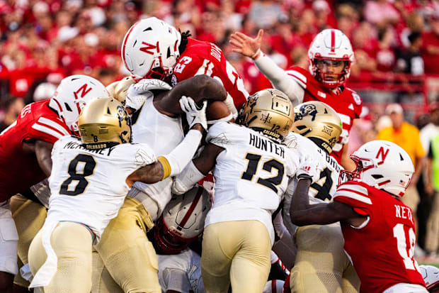 Nebraska Cornhuskers running back Dante Dowdell (23) jumps over the pile for a first down