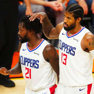 Jun 28, 2021; Phoenix, Arizona, USA; Los Angeles Clippers guard Paul George (13) and Patrick Beverley (21) against the Phoenix Suns in game five of the Western Conference Finals for the 2021 NBA Playoffs at Phoenix Suns Arena. Mandatory Credit: Mark J. Rebilas-USA TODAY Sports
