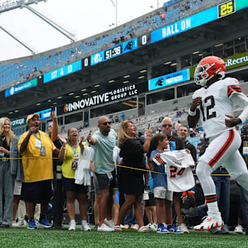 Aug 8, 2025; Charlotte, North Carolina, USA; Cleveland Browns quarterback Shedeur Sanders (12) runs on to the field before the game at Bank of America Stadium. Mandatory Credit: Bob Donnan-Imagn Images