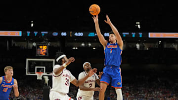 Apr 5, 2025; San Antonio, TX, USA; Florida Gators guard Walter Clayton Jr. (1) shoots the ball against Auburn Tigers forward Chaney Johnson (31) during the second half in the semifinals of the men's Final Four of the 2025 NCAA Tournament at the Alamodome. Mandatory Credit: Bob Donnan-Imagn Images