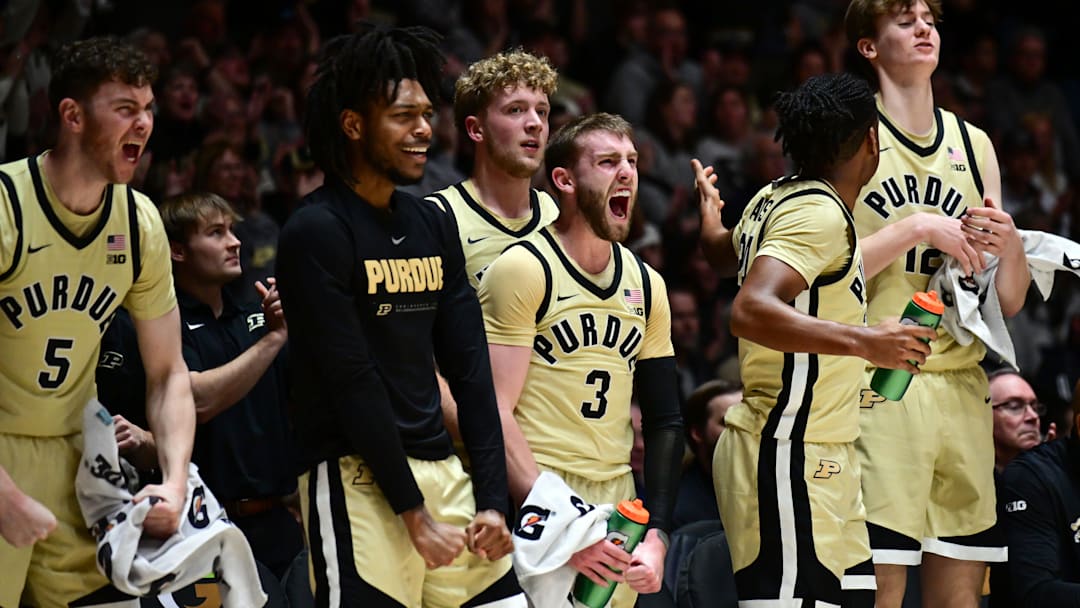 The Purdue Boilermakers bench celebrates a basket