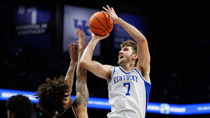 Jan 14, 2025; Lexington, Kentucky, USA; Kentucky Wildcats forward Andrew Carr (7) shoots the ball over Texas A&M Aggies forward Andersson Garcia (11) during the second half at Rupp Arena at Central Bank Center. Mandatory Credit: Jordan Prather-Imagn Images