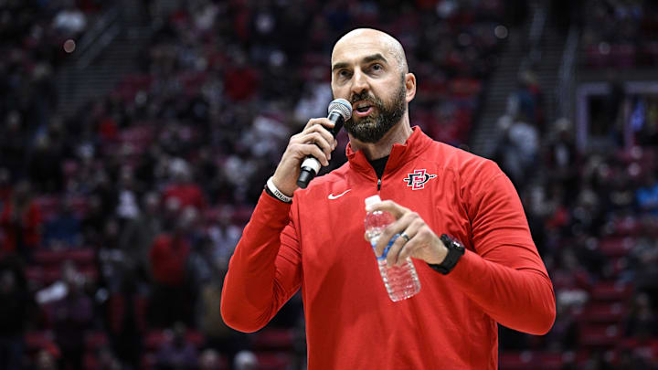 Dec 9, 2023; San Diego, California, USA; San Diego State Aztecs football coach Sean Lewis speaks to the crowd during halftime of the game between the Aztecs and the UC Irvine Anteaters at Viejas Arena. Mandatory Credit: Orlando Ramirez-Imagn Images