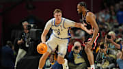 Apr 5, 2025; San Antonio, TX, USA; Duke Blue Devils forward Cooper Flagg (2) dribbles the ball against Houston Cougars forward J'Wan Roberts (13) during the first half in the semifinals of the men's Final Four of the 2025 NCAA Tournament at the Alamodome. Mandatory Credit: Bob Donnan-Imagn Images