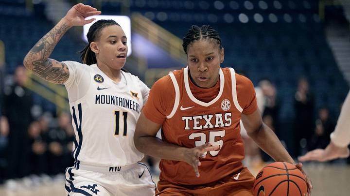 Dec 1, 2024; Estero, FL, USA; University of Texas Madison Booker (35) dribbles the ball while defended by West Virginia University Sydney Shaw (11) in the fourth quarter during the Women's Gulf Coast Showcase at Hertz Arena. Mandatory Credit: Chris Tilley-Imagn Images