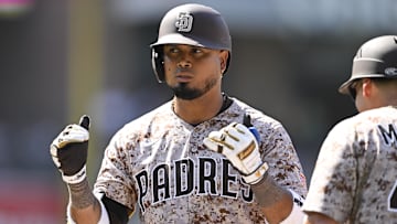 Aug 10, 2025; San Diego, California, USA; San Diego Padres first baseman Luis Arraez (4) gestures after hitting a single during the seventh inning against the Boston Red Sox at Petco Park. Mandatory Credit: Denis Poroy-Imagn Images