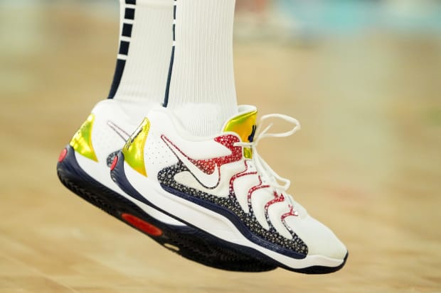 USA forward Kevin Durant's white and blue Nike sneakers.