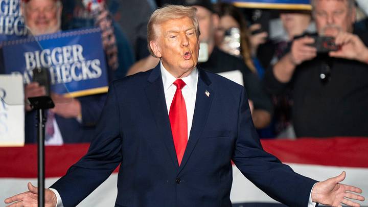 President Donald Trump takes the stage during a rally at Horizon Events Center on Tuesday, Jan. 27, 2026 in Clive.