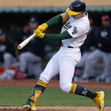 Jun 21, 2024; Oakland, California, USA; Oakland Athletics first base Tyler Soderstrom (21) hits a two RBI double against the Minnesota Twins during the fifth inning at Oakland-Alameda County Coliseum. Mandatory Credit: Stan Szeto-USA TODAY Sports