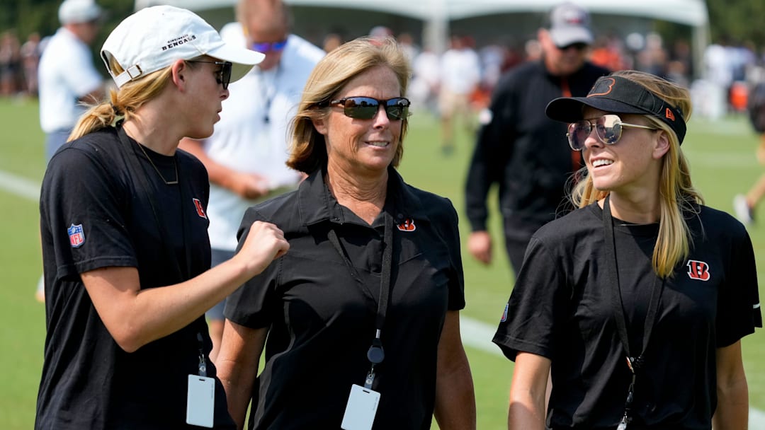 Bengals executive Vice President Katie Blackburn (center) walks off the practice field with her daughters Caroline and Elizabeth during a training camp practice at the Paycor Stadium practice facility in downtown Cincinnati on Tuesday, Aug. 1, 2023. Tuesday marked the team’s first preseason practice in pads. Bengals executive Vice President Katie Blackburn (center) walks off the practice field with her daughters Caroline and Elizabeth during a training camp practice at the Paycor Stadium practice facility in downtown Cincinnati on Tuesday, Aug. 1, 2023. Tuesday marked the team’s first preseason practice in pads.