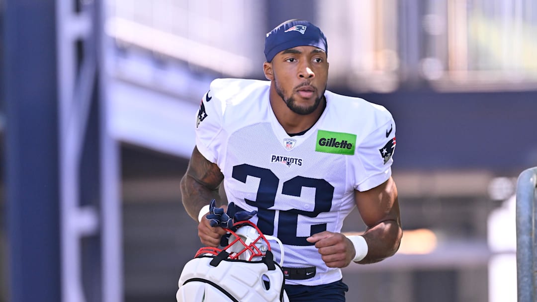 Jul 28, 2025; Foxborough, MA, USA; New England Patriots running back TreVeyon Henderson (32) heads to the practice fields for training camp at Gillette Stadium. Mandatory Credit: Eric Canha-Imagn Images