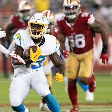 Los Angeles Chargers running back Aaron Shampklin (23) runs with the football during the fourth quarter against San Francisco 49ers cornerback Isaiah Oliver (26) at Levi's Stadium in 2023.