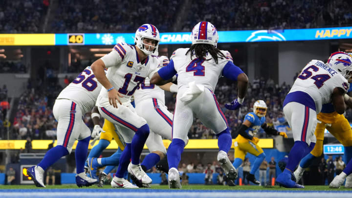 Dec 23, 2023; Inglewood, California, USA; Buffalo Bills quarterback Josh Allen (17) hands off to running back James Cook (4) against the Los Angeles Chargers at SoFi Stadium. Mandatory Credit: Kirby Lee-USA TODAY Sports