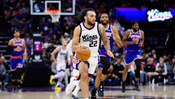 Mar 10, 2025; Sacramento, California, USA; Sacramento Kings guard Devin Carter (22) dribbles the ball up the court against the New York Knicks during the fourth quarter at Golden 1 Center. Mandatory Credit: Sergio Estrada-Imagn Images