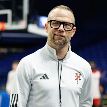 Mar 19, 2025; Lexington, KY, USA; Louisville Cardinals head coach Pat Kelsey talks to media members on the sideline during practice at Rupp Arena. Mandatory Credit: Jordan Prather-Imagn Images