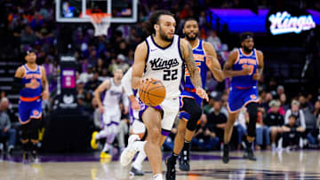 Mar 10, 2025; Sacramento, California, USA; Sacramento Kings guard Devin Carter (22) dribbles the ball up the court against the New York Knicks during the fourth quarter at Golden 1 Center. Mandatory Credit: Sergio Estrada-Imagn Images