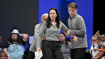 Aug 8, 2025; Arlington, Texas, USA; New York Liberty head coach Sandy Brondello is restrained by her staff after Brondello receives a technical foul during the second half against the Dallas Wings at College Park Center. Mandatory Credit: Jerome Miron-Imagn Images