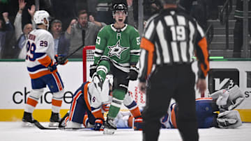 Nov 18, 2025; Dallas, Texas, USA; Dallas Stars center Wyatt Johnston (53) celebrates after he scores a goal past New York Islanders defenseman Ryan Pulock (6) and goaltender David Rittich (33) during the third period at the American Airlines Center. Upon review the goal is overturned by the referees due to goaltender interference. Mandatory Credit: Jerome Miron-Imagn Images