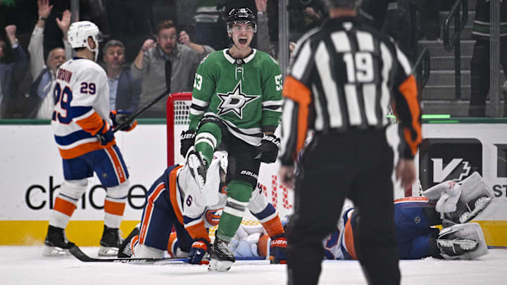 Nov 18, 2025; Dallas, Texas, USA; Dallas Stars center Wyatt Johnston (53) celebrates after he scores a goal past New York Islanders defenseman Ryan Pulock (6) and goaltender David Rittich (33) during the third period at the American Airlines Center. Upon review the goal is overturned by the referees due to goaltender interference. Mandatory Credit: Jerome Miron-Imagn Images