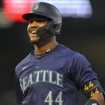 Seattle Mariners outfielder Julio Rodriguez smiles after a single against the Los Angeles Angels on July 13 at Angel Stadium.