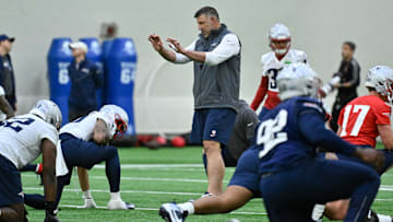 May 9, 2025; Foxborough, MA, USA; New England Patriots head coach Mike Vrabel (c) works with players at rookie camp at Gillette Stadium. Mandatory Credit: Eric Canha-Imagn Images