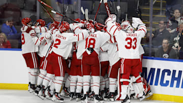 Mar 29, 2025; Toledo, OH, USA;  Boston University forward Quinn Hutson (17) receives congratulations from teammates after scoring the winning goal in overtime against the Cornell at Huntington Center. Mandatory Credit: Rick Osentoski-Imagn Images