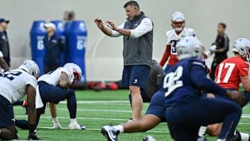 May 9, 2025; Foxborough, MA, USA; New England Patriots head coach Mike Vrabel (c) works with players at rookie camp at Gillette Stadium. Mandatory Credit: Eric Canha-Imagn Images