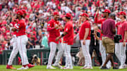 The Cincinnati Reds celebrate a win after the ninth inning of the MLB National League game between the Cincinnati Reds and the Pittsburgh Pirates at Great American Ball Park in downtown Cincinnati on Thursday, Sept. 25, 2025. The Reds won, 2-1.