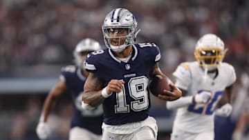 Aug 24, 2024; Arlington, Texas, USA; Dallas Cowboys quarterback Trey Lance (19) runs for a touchdown against the Los Angeles Chargers in the third quarter at AT&T Stadium. Mandatory Credit: Tim Heitman-Imagn Images