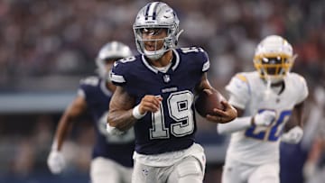 Aug 24, 2024; Arlington, Texas, USA; Dallas Cowboys quarterback Trey Lance (19) runs for a touchdown against the Los Angeles Chargers in the third quarter at AT&T Stadium. Mandatory Credit: Tim Heitman-Imagn Images