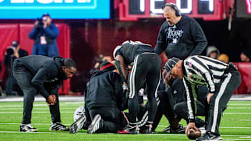 Nebraska Cornhuskers head coach Matt Rhule looks on as  quarterback Dylan Raiola is attended to after his third-quarter injury Saturday night against the USC Trojans.