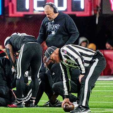 Nebraska Cornhuskers head coach Matt Rhule looks on as  quarterback Dylan Raiola is attended to after his third-quarter injury Saturday night against the USC Trojans.