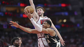 Milwaukee Bucks forward Giannis Antetokounmpo attempts to drive with the ball around Houston Rockets center Alperen Sengun.